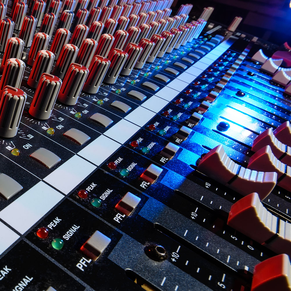 detail sound mixer in red and blue light with great perspective,
