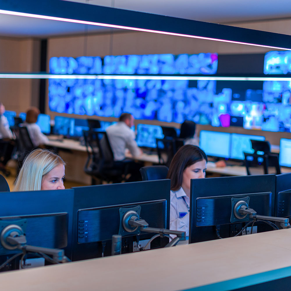 Male computer operator monitoring from a security ( computer, lo